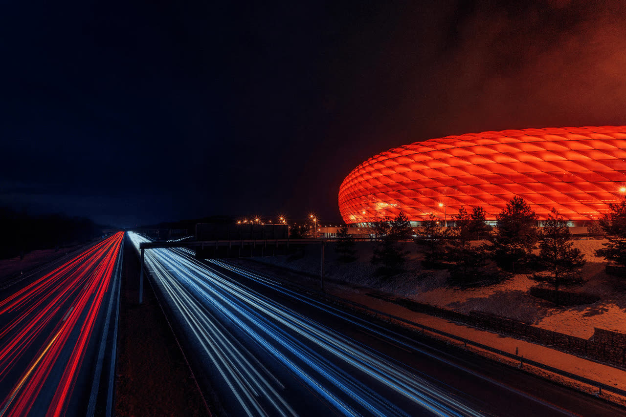 Football stadium lit up at night